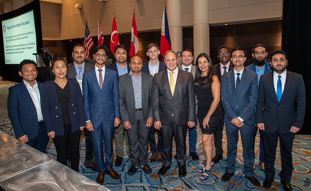 Group of international otolaryngologists posting together at International General Assembly