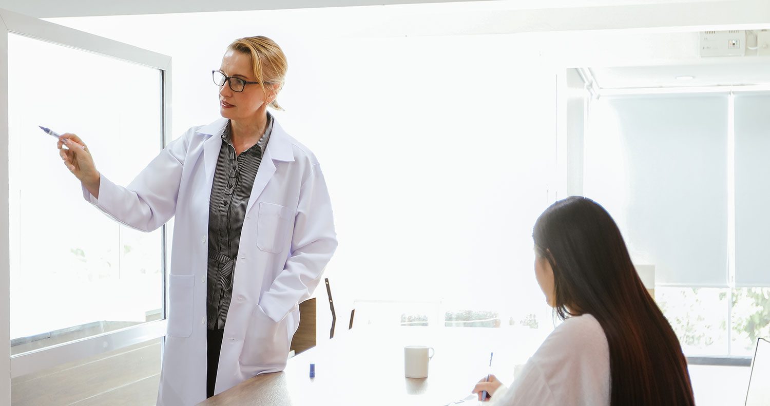 female physician mentoring female medical student