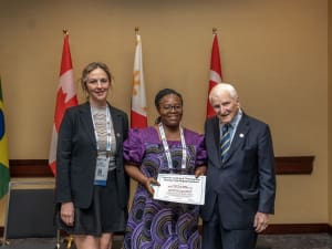 Foluso Mercy Adeyeye, MD, receiving a 2025 Eugene N. Myers Global Education Fund Grant